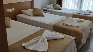 Quarto triplo standard | Roupa de cama