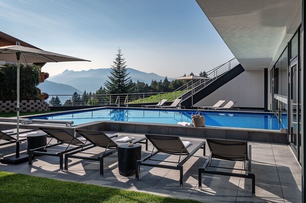 Indoor pool, outdoor pool, pool umbrellas, sun loungers