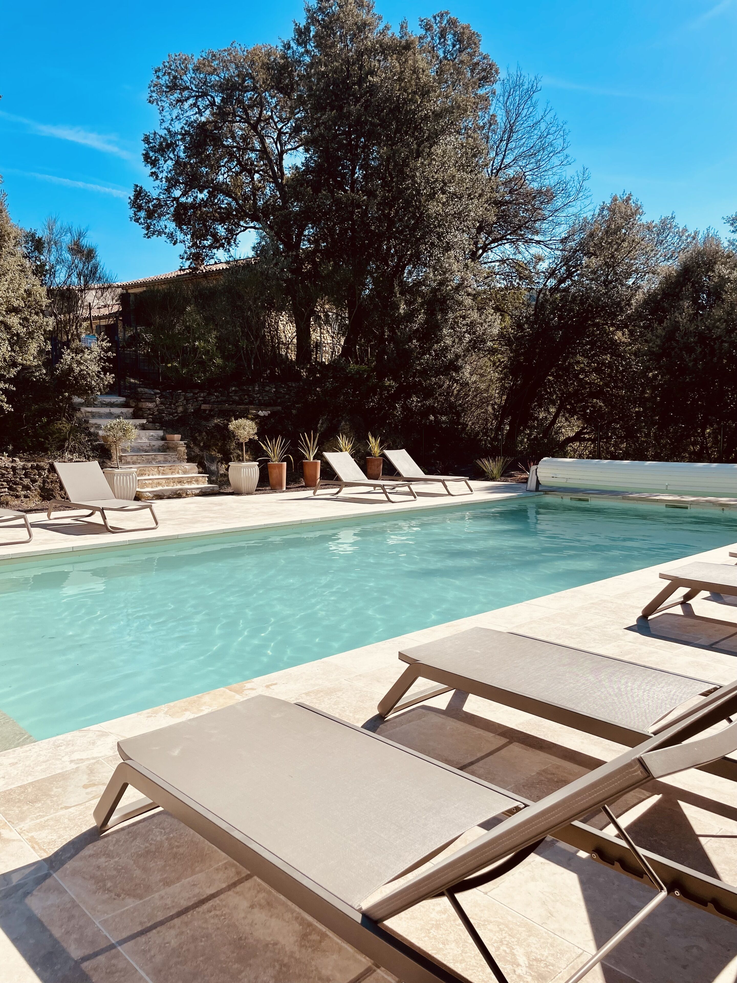 seasonal outdoor pool, open 10:00 am to 7:30 pm, pool umbrellas