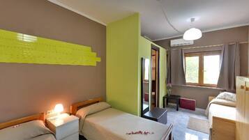 Triple Room | Individually decorated, desk, cribs/infant beds, rollaway beds