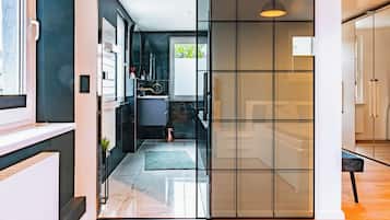 Design Condo | Bathroom | Rainfall showerhead, free toiletries, hair dryer, towels