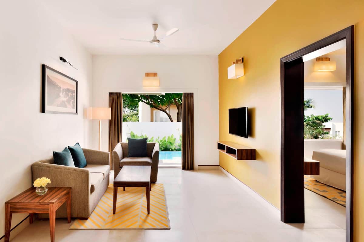 suite, 1 king bed, non smoking, pool view (balcony) | living room | 42-inch flat-screen tv with satellite channels, tv
