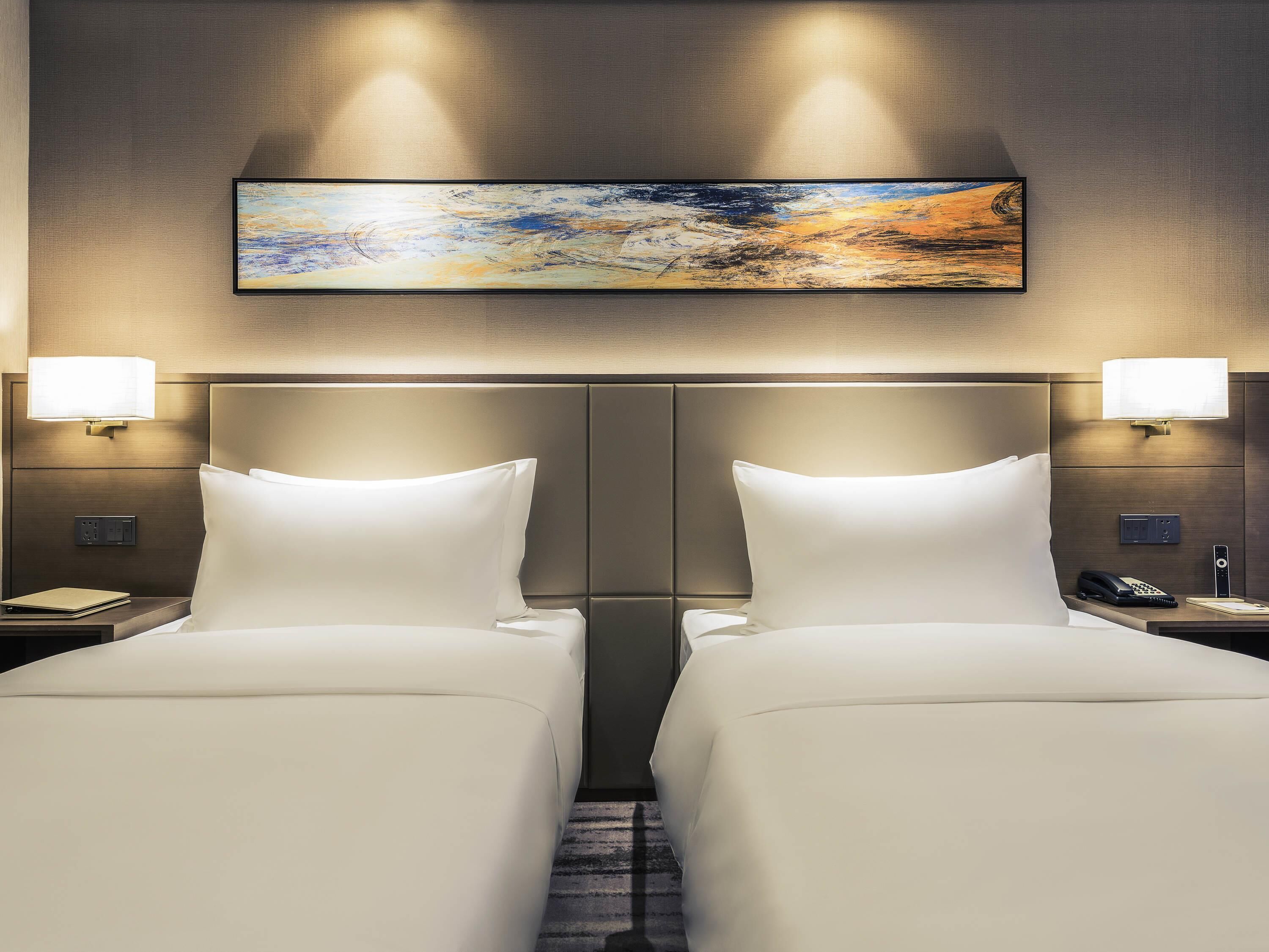 Room | Premium bedding, down comforters, blackout drapes, rollaway beds