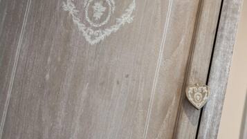 A wooden door with a heart-shaped design and a heart-shaped handle.