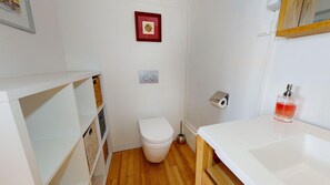 Shower, hair dryer, towels, toilet paper