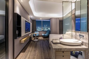 Deluxe Room, 1 King Bed, River View | Premium bedding, minibar, in-room safe, desk