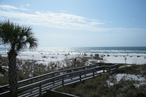On the beach, sun-loungers