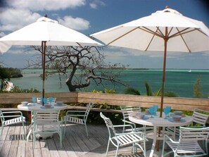 Outdoor dining - Conched Out – Luxury 5BR Estate with Private Dock & Stunning Abaco Sunsets (Elbow Cay)