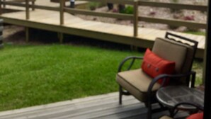 A deck with outdoor seating and a view of the beach. - Mayo Clinic under 15 min (6 miles), Beach under 2 min walk (Jacksonville Beach)