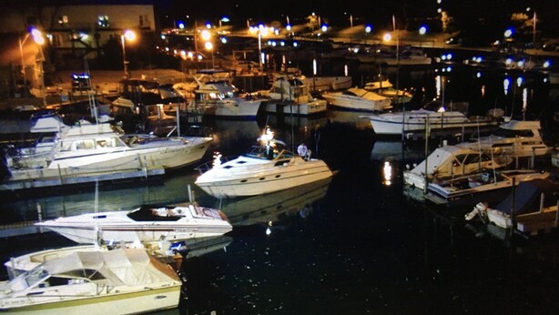 A marina with multiple boats docked at night. - Modern! Professionally Cleaned, Self Check In - Sleeps 10 (Kenosha)