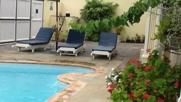 Outdoor pool, pool umbrellas, pool loungers