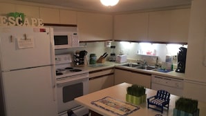 Room | Private kitchen | Coffee/tea maker, fridge, microwave, oven - Direct Ocean Front Condo (Murrells Inlet)