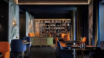 A bar area with seating and a well-stocked liquor display.