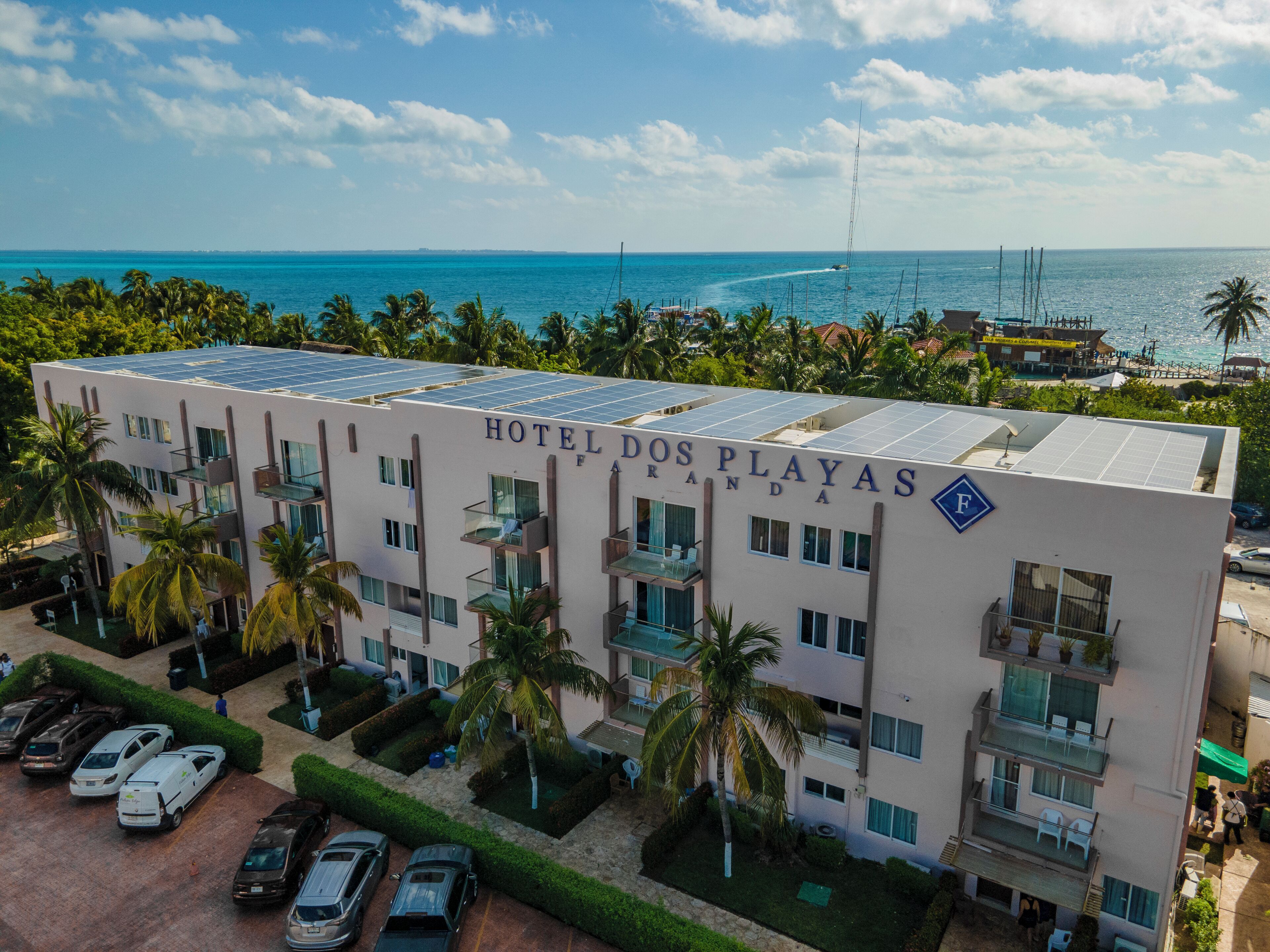 A hotel named "Hotel Dos Playas" with a view of the ocean.