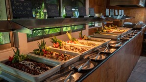 A buffet with various food options and serving utensils. - Dos Playas by Faranda All Inclusive (Cancun)