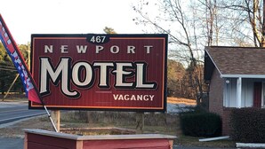 A motel sign with '467 Newport' and 'Motel' written on it, and a 'VAGANZY' label. - Newport Motel (Newport)