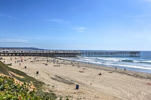 A beach with a pier extending into the ocean, sandy beach, and a clear sky. - Cozy San Diego Escape w/ Yard, Near Beaches! (San Diego)