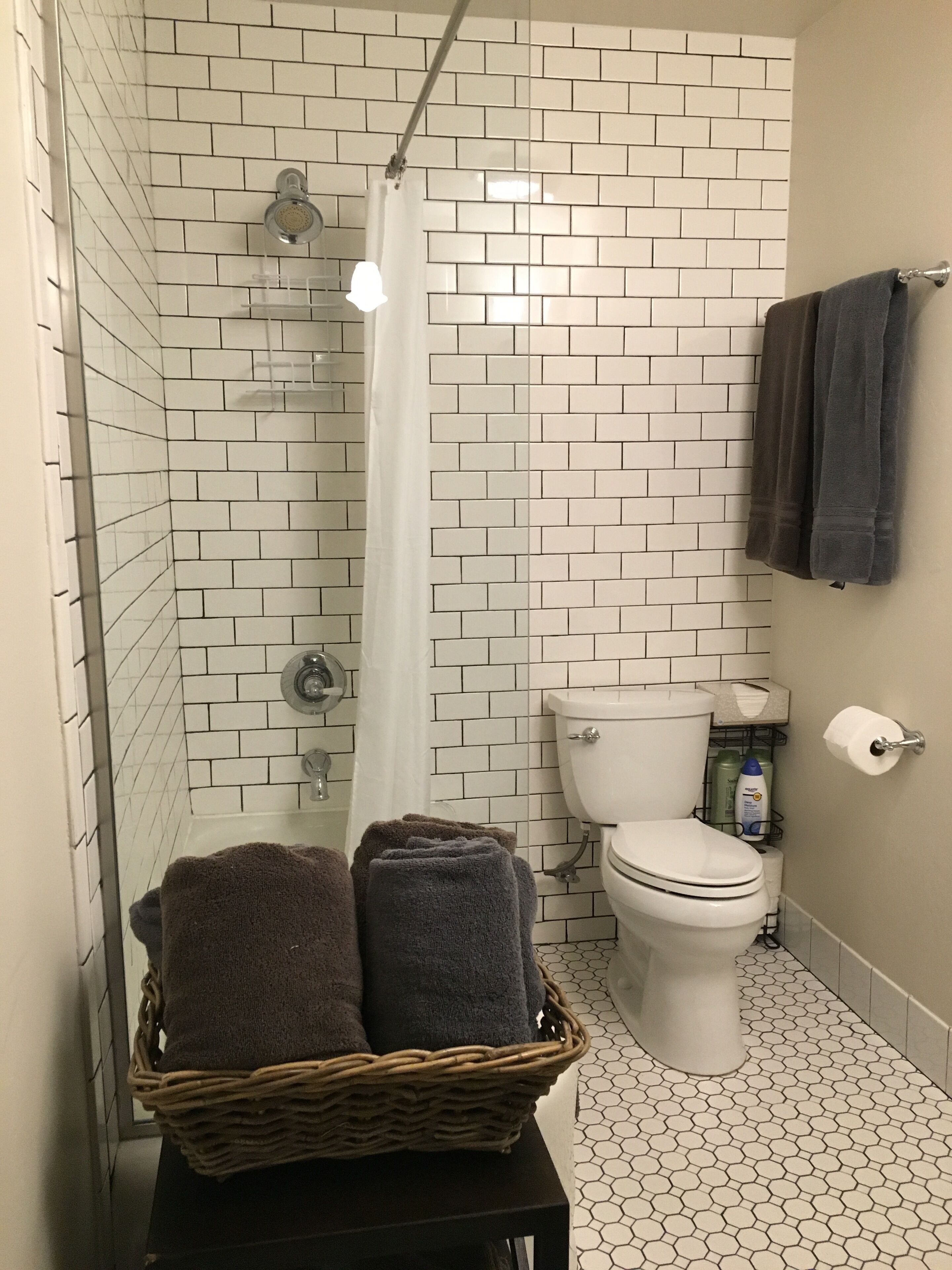 Combined shower/tub, hair dryer, towels, soap