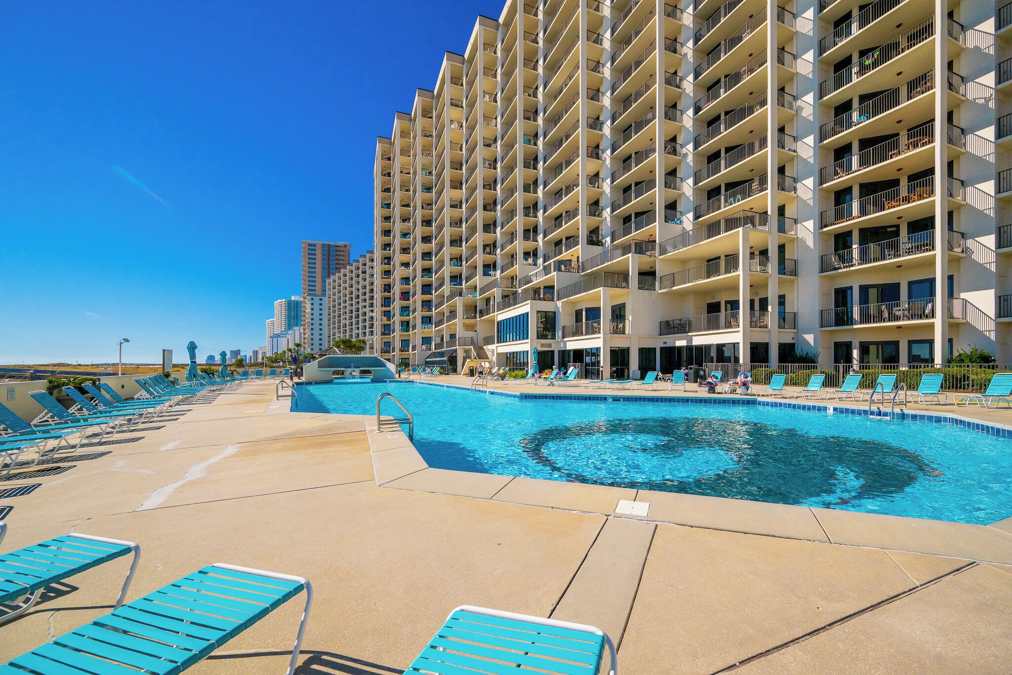 Relax by the pool and soak in the beachfront views from this inviting rental property, perfect for your getaway