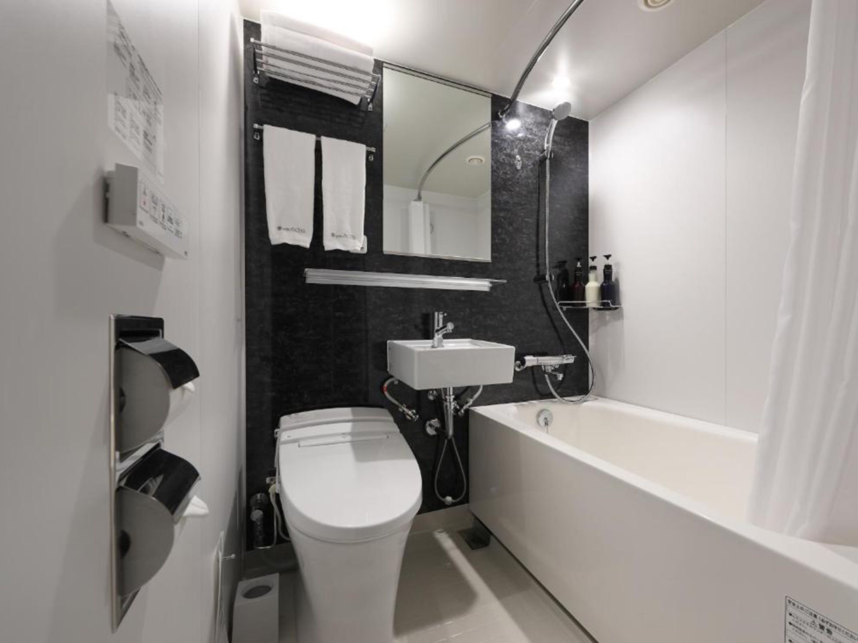 combined shower/bathtub, free toiletries, hair dryer, slippers