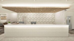 A reception area with a modern design, featuring a reception desk, a patterned wall, and a wooden ceiling. - Utsunomiya Hotel Maruji (Utsunomiya)