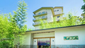 A building with a traditional Japanese architectural style, featuring a flat roof and a wooden entrance. - Wakatake no Sho (Nikko)