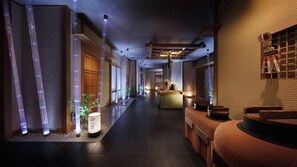 A corridor with a reception desk, bamboo decorations, and a traditional Japanese aesthetic. - Wakatake no Sho (Nikko)