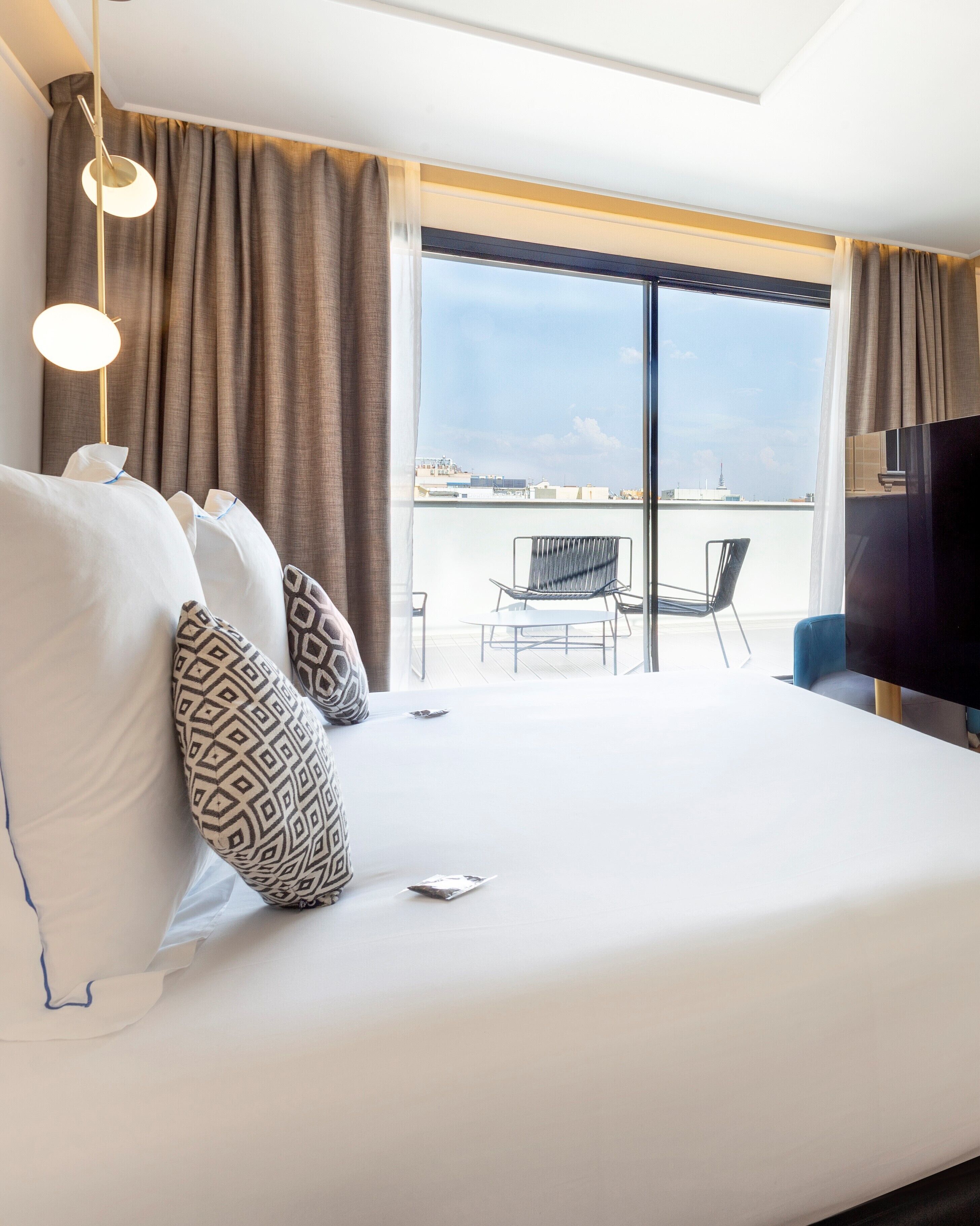 deluxe room, terrace | minibar, in-room safe, desk, blackout curtains