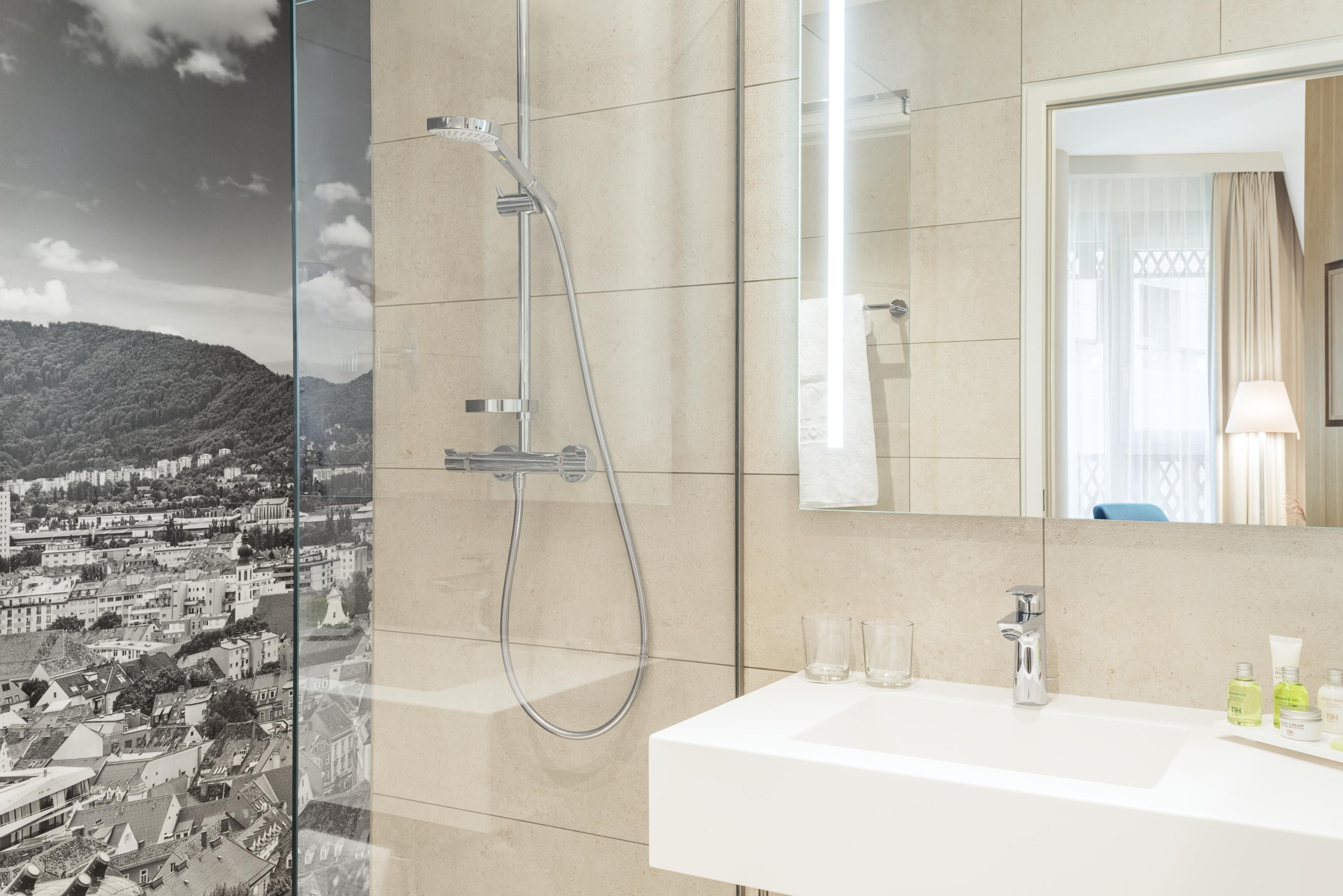 Shower, designer toiletries, hair dryer, slippers