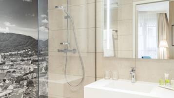 Shower, designer toiletries, hair dryer, slippers