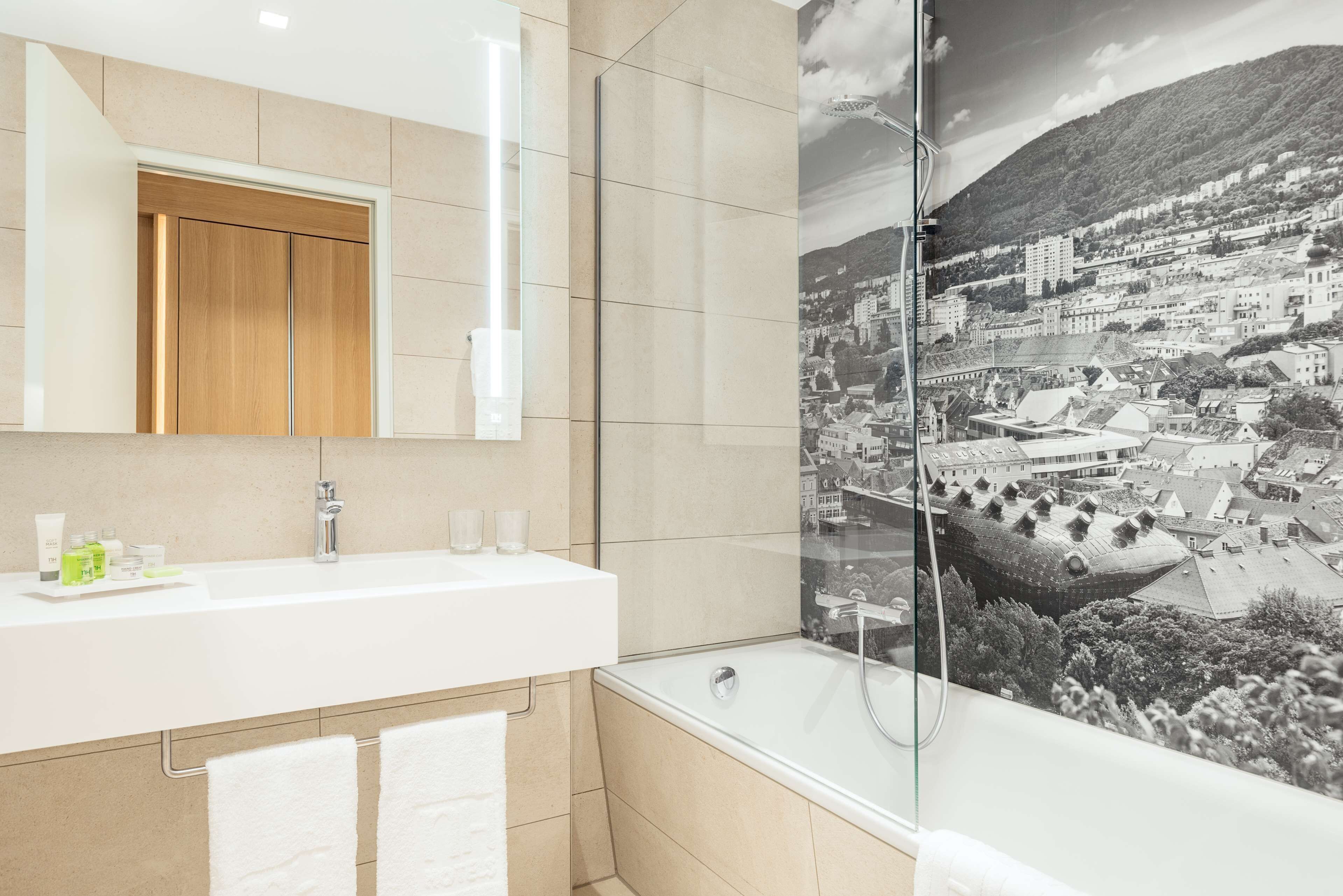 shower, designer toiletries, hair dryer, slippers