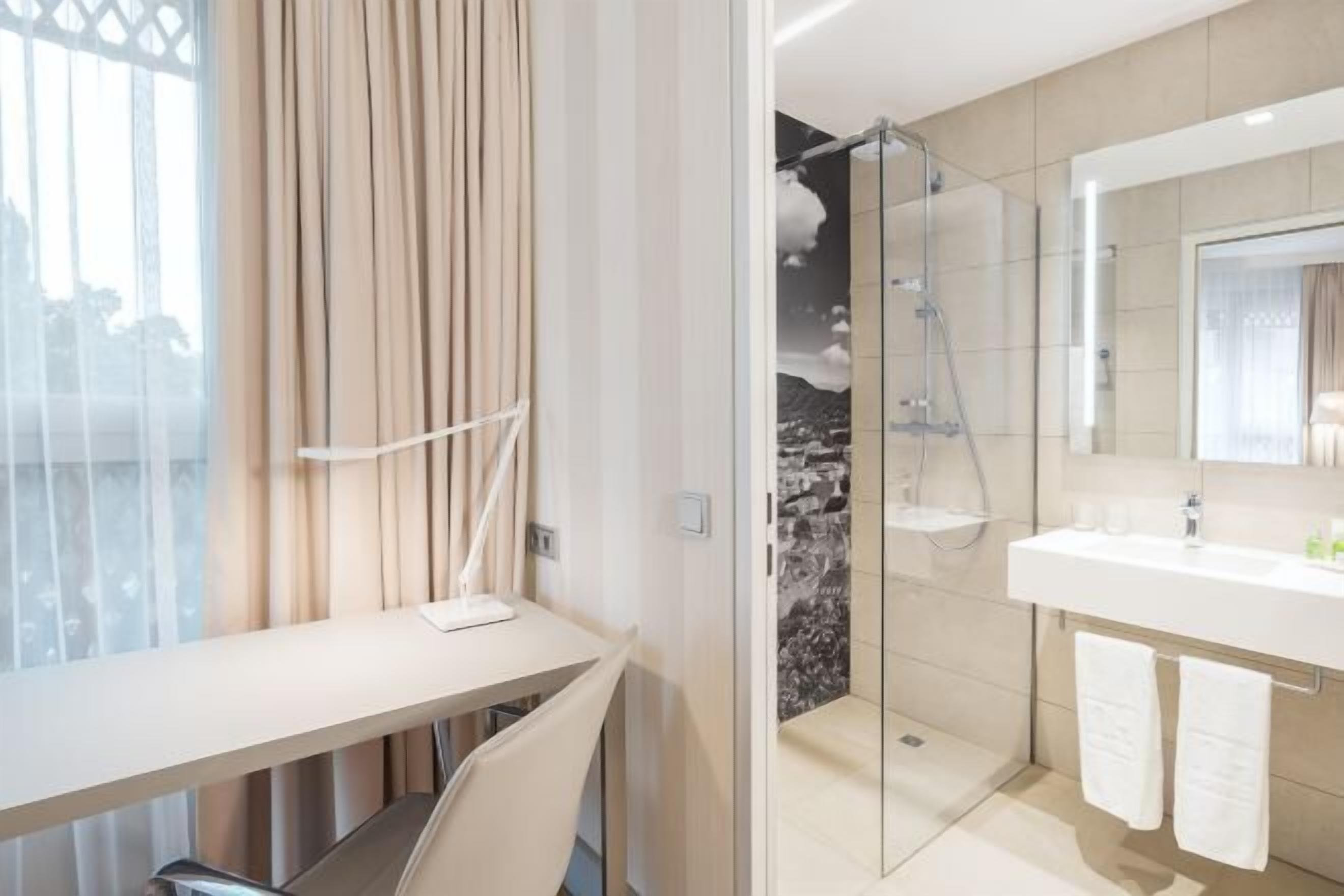 Bathroom | Shower, designer toiletries, hair dryer, slippers