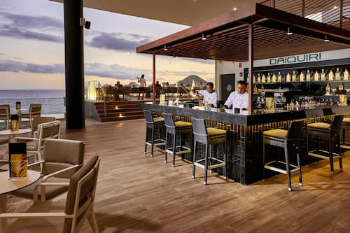 6 bars/lounges, swim-up bar, poolside bar