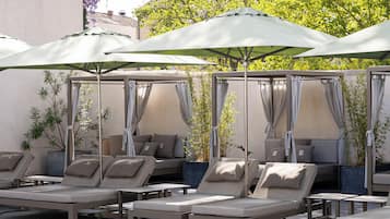 Indoor pool, seasonal outdoor pool, open 9 AM to 8 PM, pool umbrellas