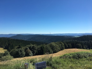 A view of a mountainous landscape with a clear sky.