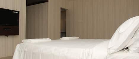 Habitación Deluxe | Ropa de cama de alta calidad y caja de seguridad en la habitación