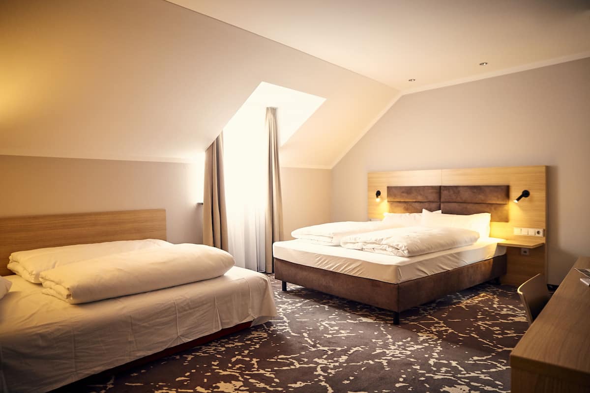 Deluxe Quadruple Room | In-room safe, desk, blackout drapes, soundproofing