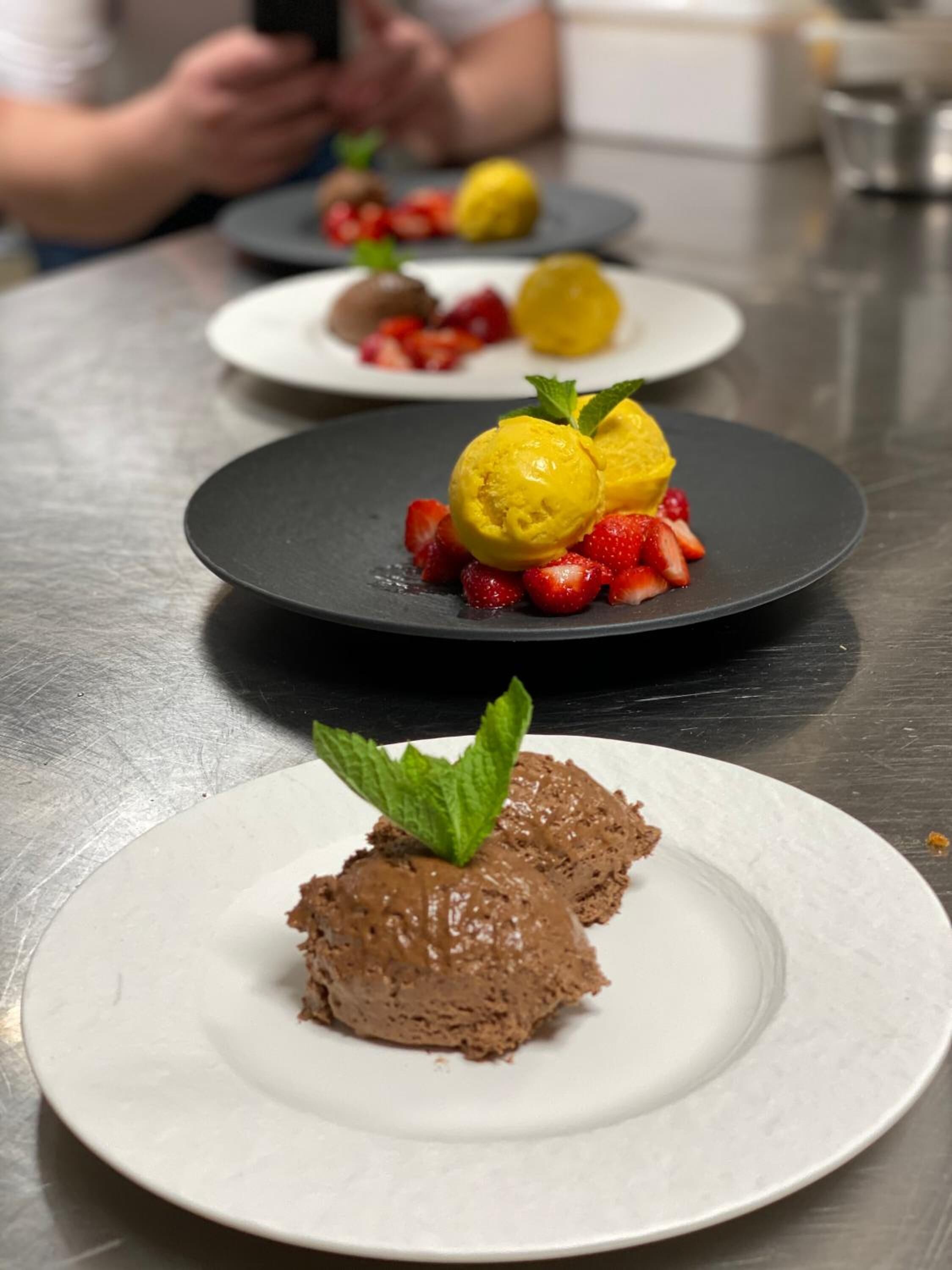 Three dessert plates on a table.