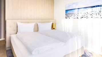 Premium bedding, blackout curtains, soundproofing, cots/infant beds