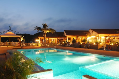 Seasonal outdoor pool, open 9:00 AM to 7:00 PM, pool umbrellas