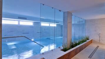 Indoor pool, open 9 AM to 10 PM, pool loungers