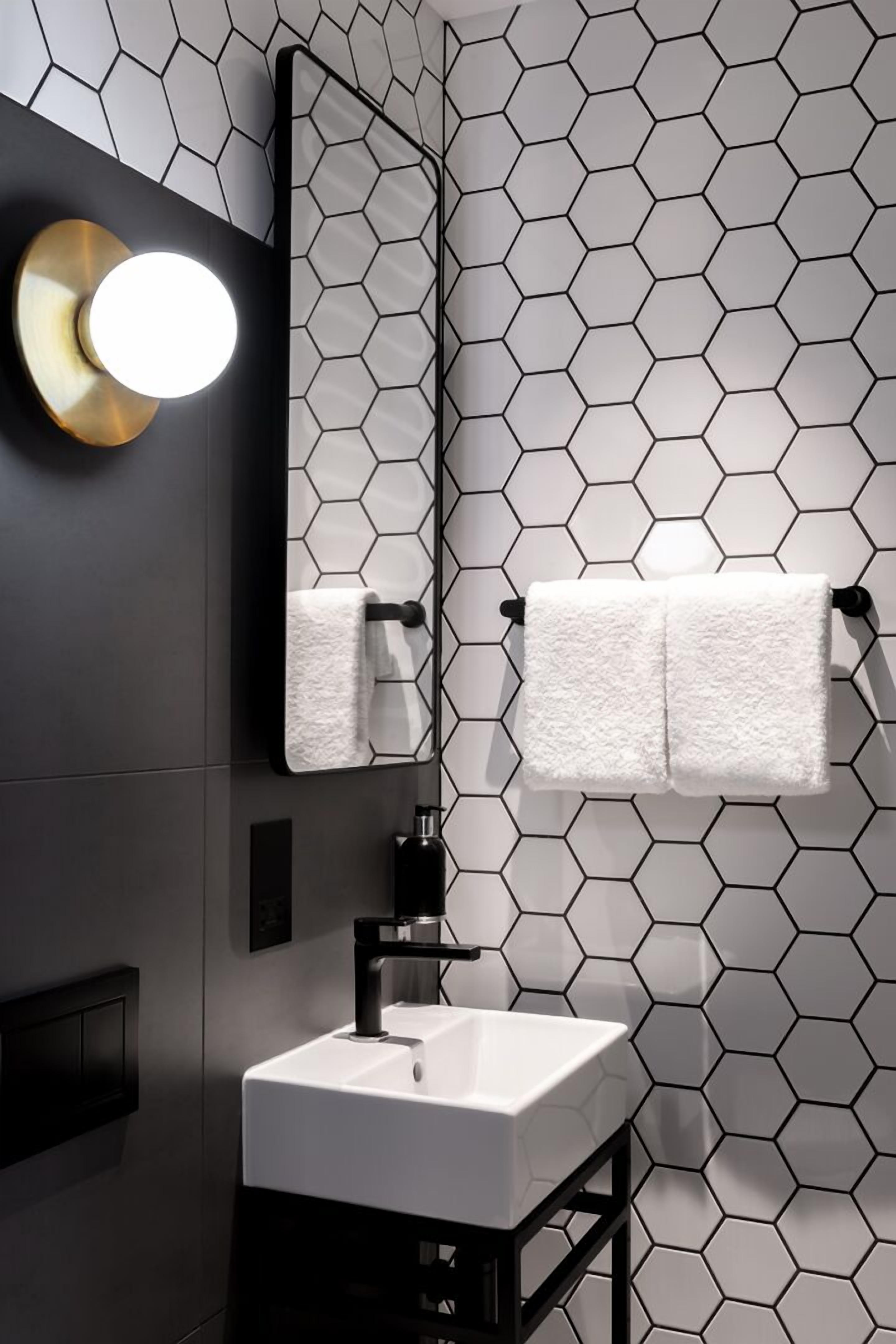 modern room, spread out and settle in | bathroom | shower, free toiletries, hair dryer, towels