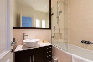 Separate tub and shower, towels