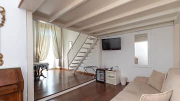Suite junior | Sala de estar | Televisión de pantalla plana