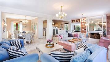 Deluxe Villa, 4 Bedrooms, Private Pool | Living area | 55-inch flat-screen TV with digital channels, TV, fireplace