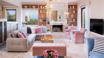 Deluxe Villa, 4 Bedrooms, Private Pool | Living area | 55-inch flat-screen TV with digital channels, TV, fireplace