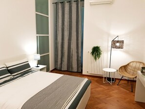 Familien-Vierbettzimmer (Suite affresco) | Hochwertige Bettwaren, Minibar, Zimmersafe, individuell dekoriert