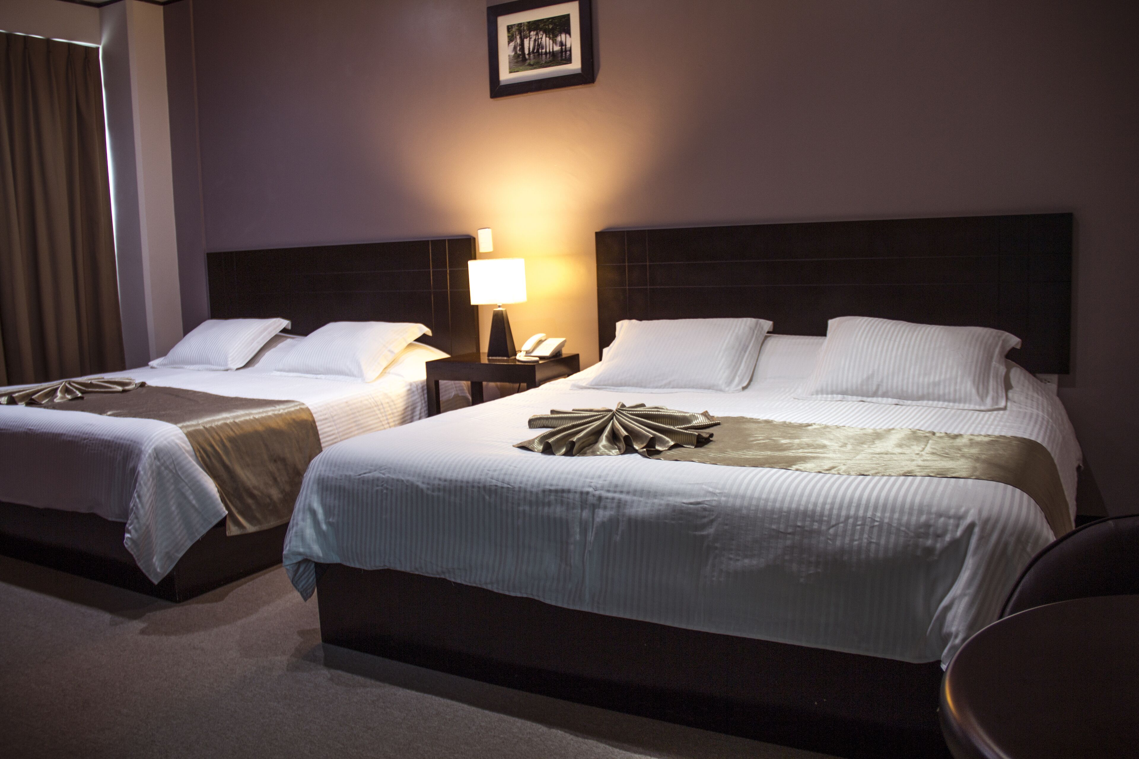 family double room, multiple beds | in-room safe, desk, iron/ironing board, free wifi