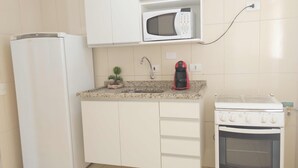 Apartment (K1X$02) | Private kitchen | Coffee/tea maker, full-sized fridge, microwave, oven