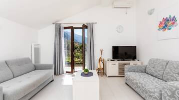 Apartment, 1 Bedroom, Balcony | Living area | Flat-screen TV